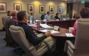 A group sits in the FPPA board room