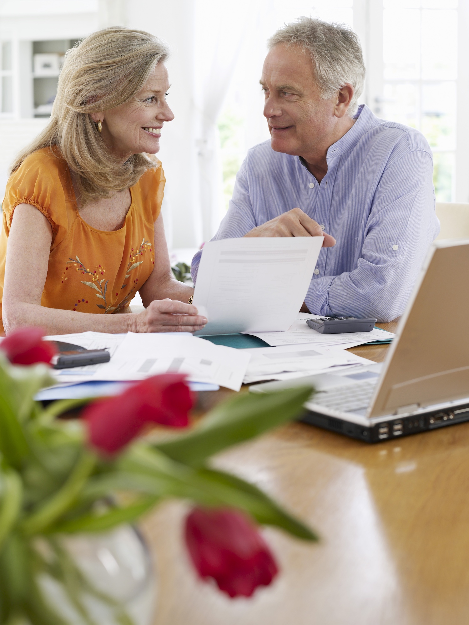 retired couple compares financial notes