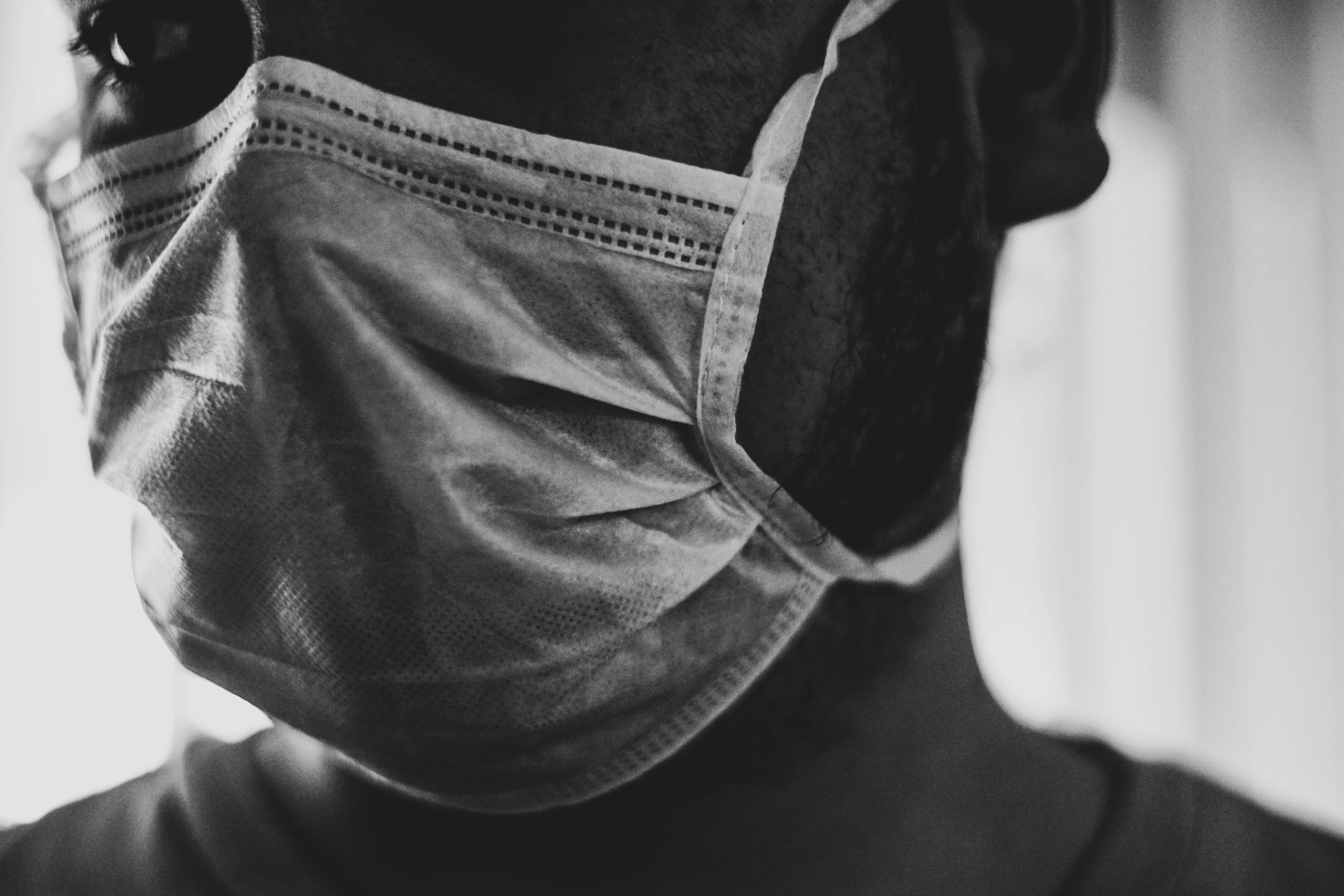 Close up of person wearing surgical mask