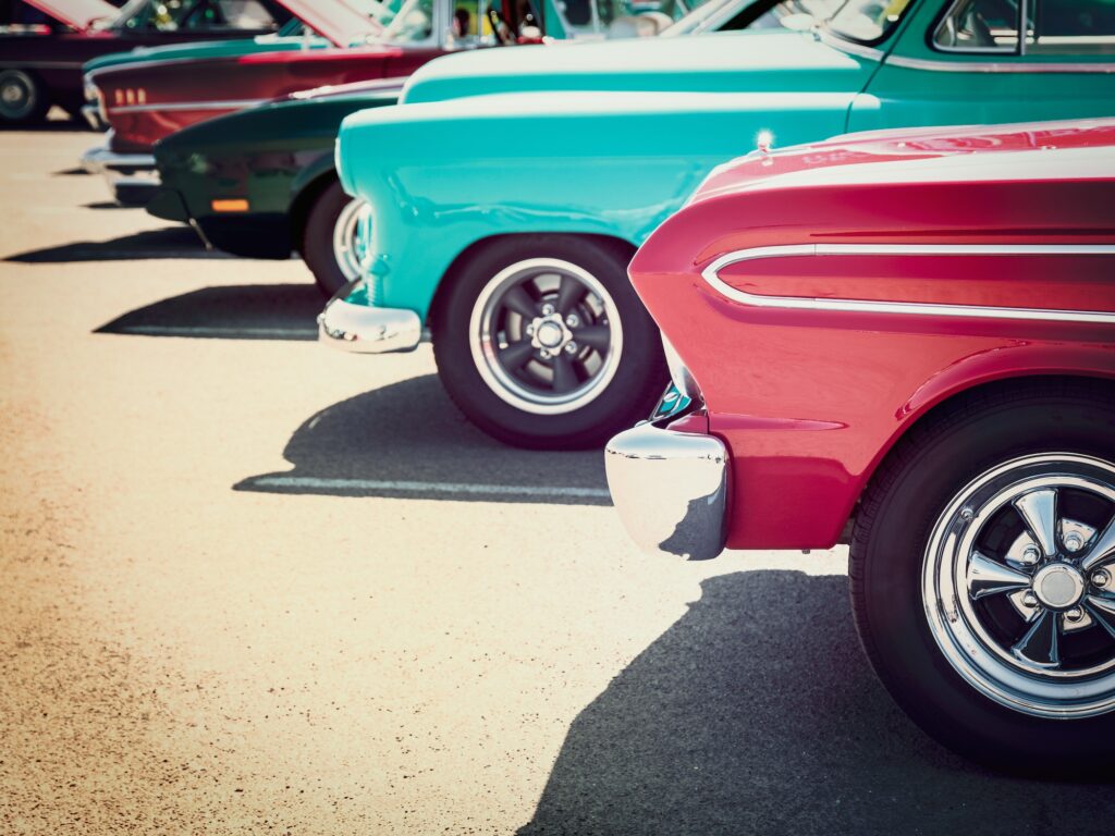 side view of lined up classic cars