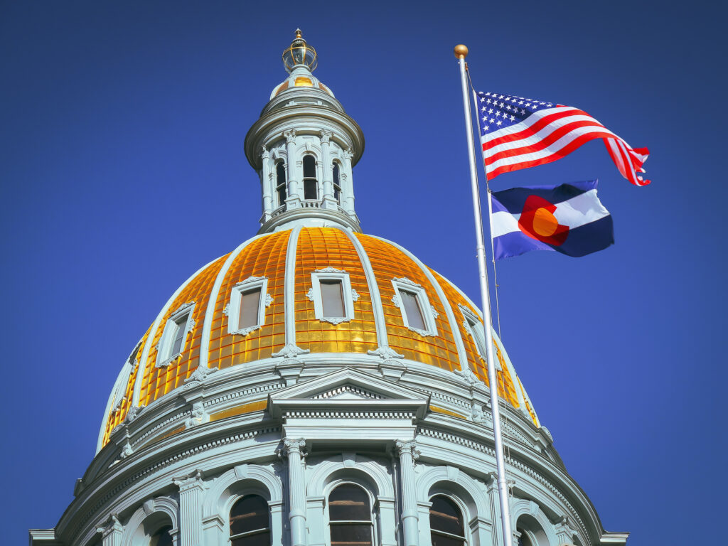 Colorado state capitol with US and Colorado state flags flying