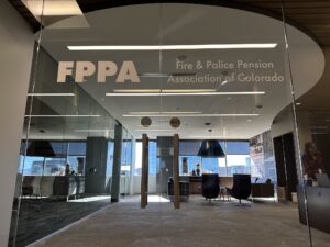 Writing on glass doors in an office building read "FPPA | Fire & Police Pension Association"