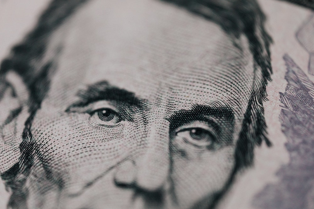 detailed close up of the front face of US five dollar bill