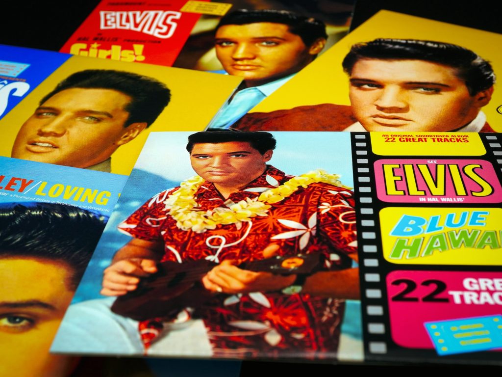 a stack of elvis presley album covers