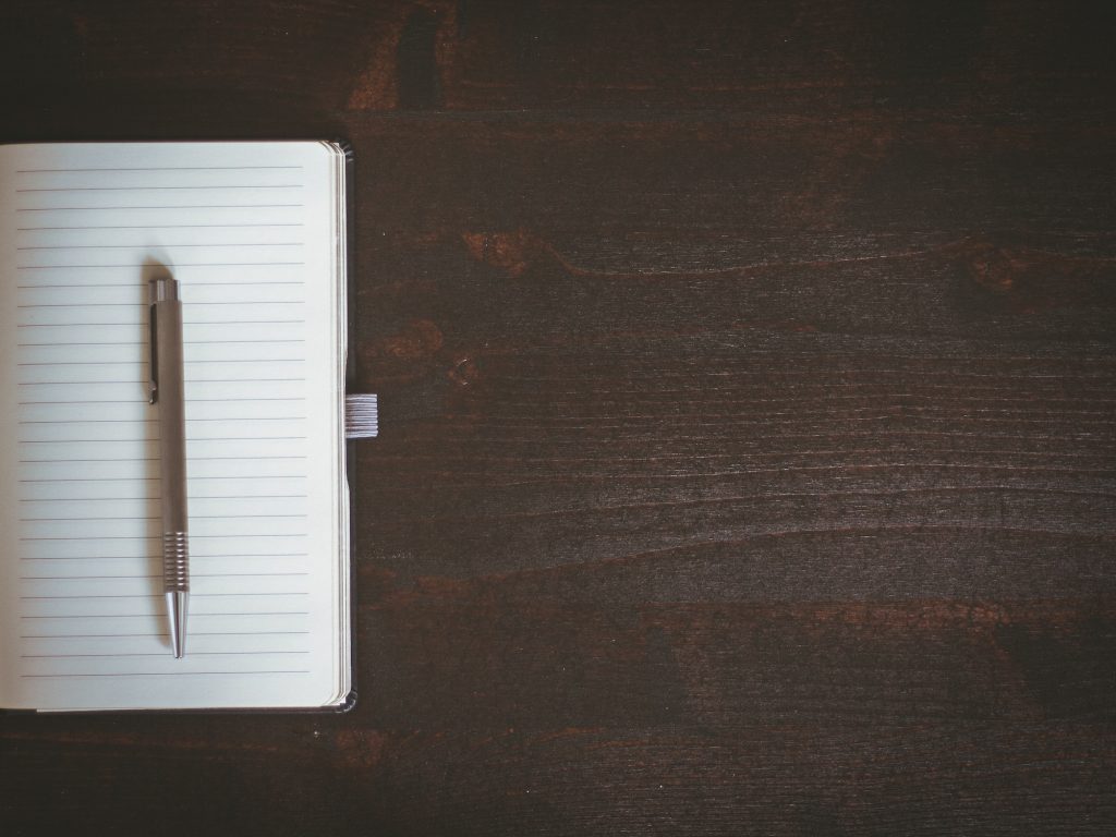 blank notebook on wooden table
