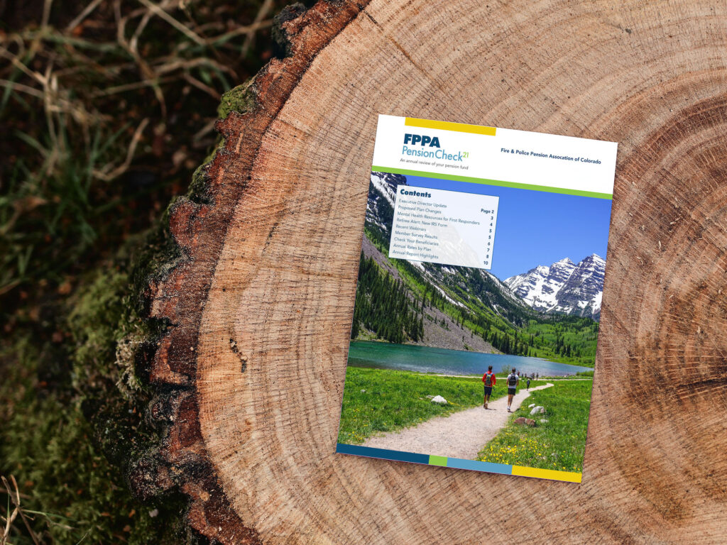 FPPA newsletter sits on a tree stump in the woods